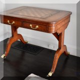F02. Maitland-Smith game table. 29.5”h x 37”w x 26”d 